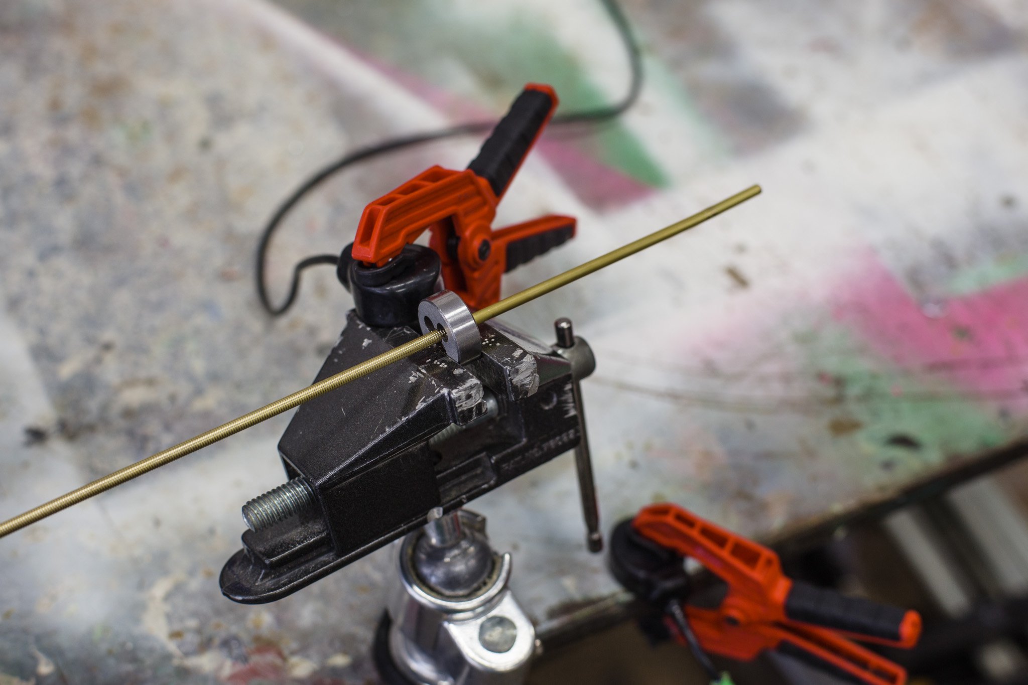 Preparing the brass sticks for winding lacquered wire for the windstrument